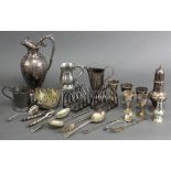 A Victorian engraved wine jug, 9¾”; a pair of four-division toast racks; five egg cups; a baluster