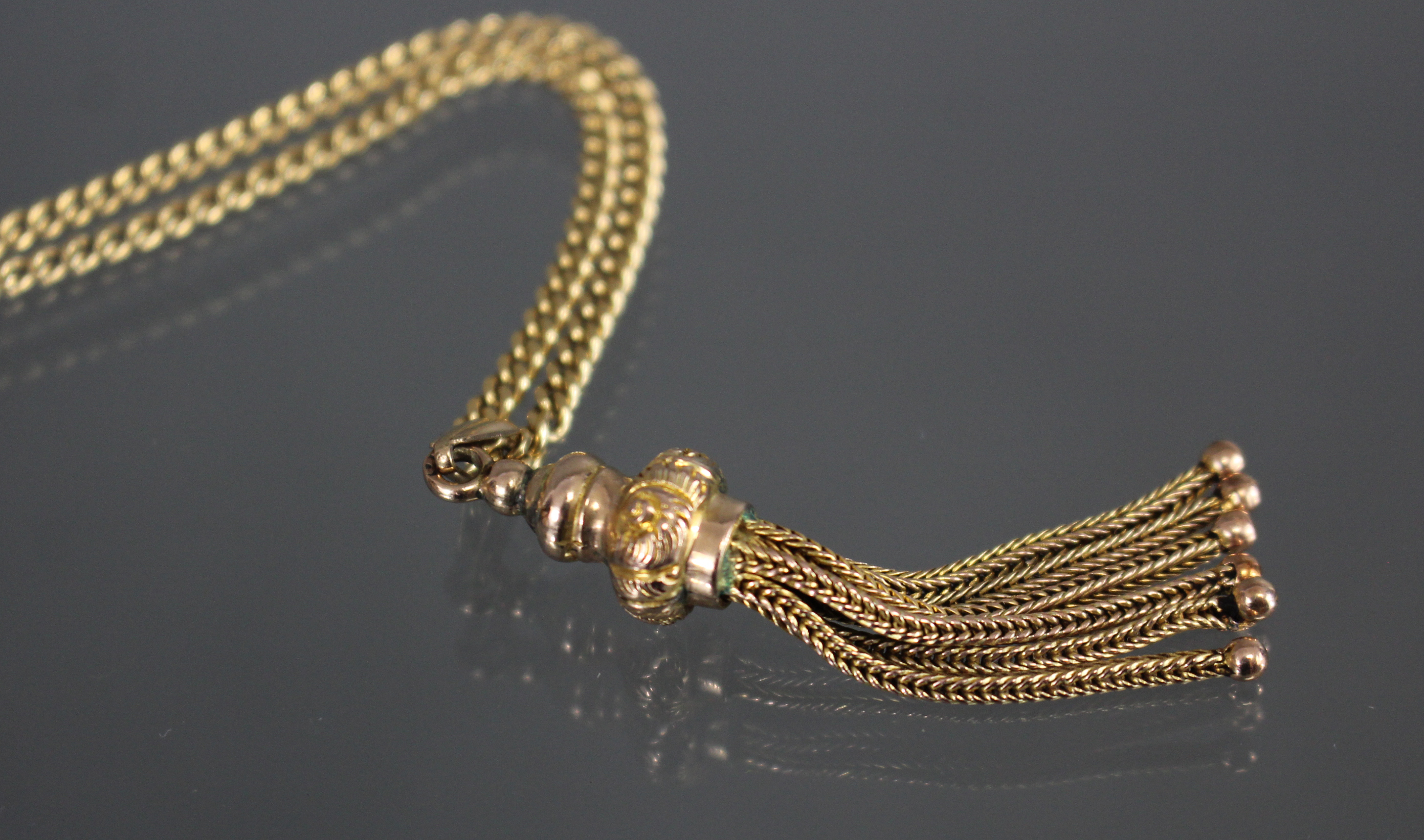 A yellow metal chain necklace of flattened curb links, marked “750”, 24” long (13.4gm); with gilt- - Image 3 of 3