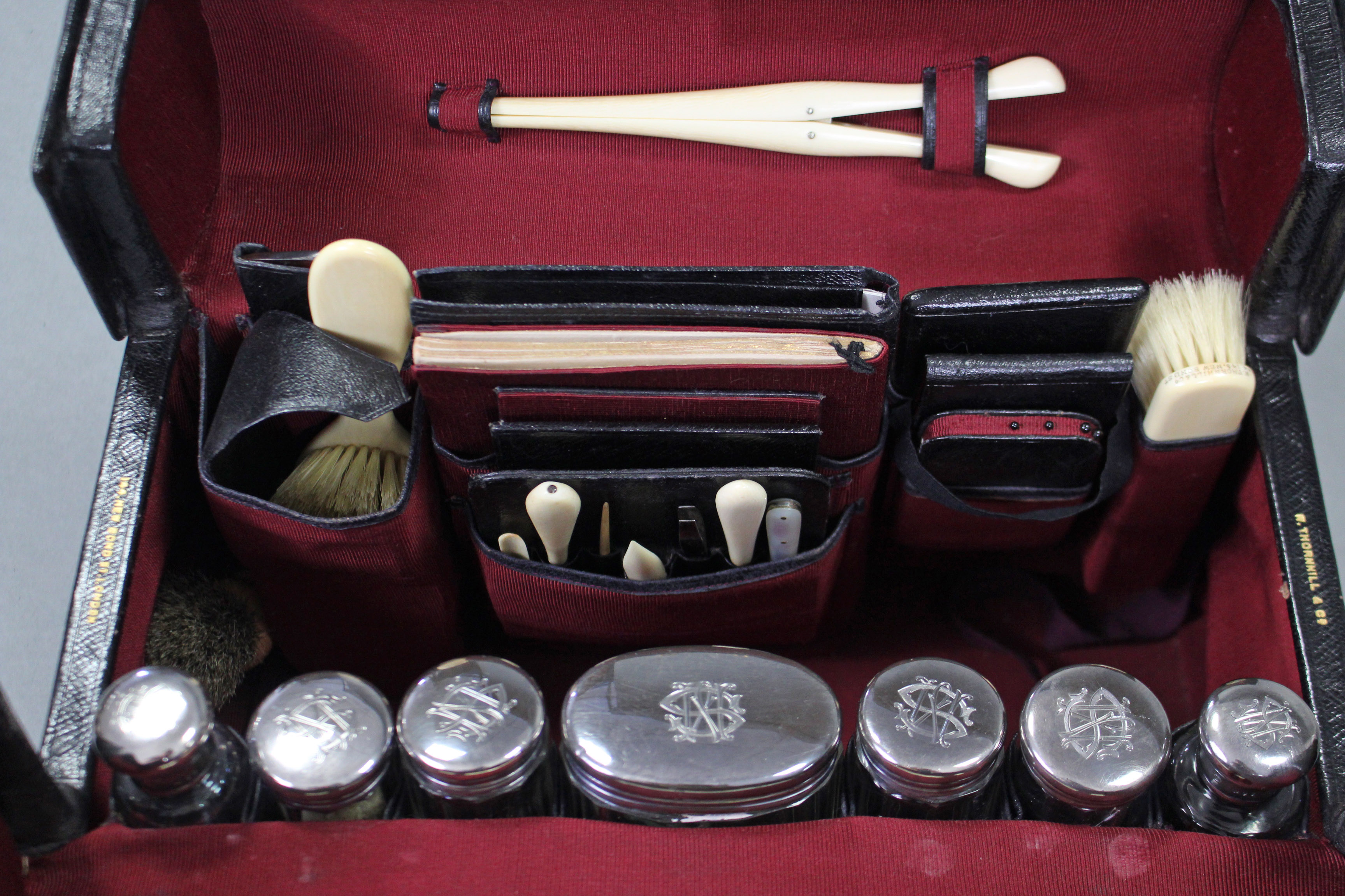 A late Victorian gentleman’s black leather travelling toilet case by W. Thornhill of New Bond St., - Image 4 of 7