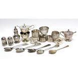Six silver napkin rings; a small silver bowl; six small condiments; & five teaspoons.