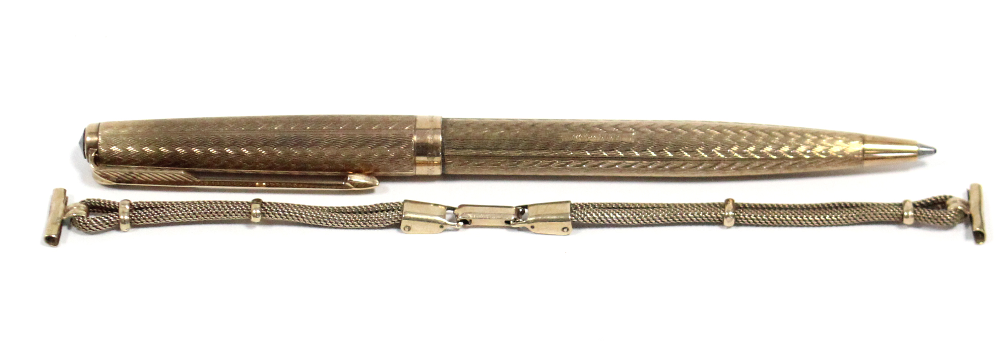 A Parker ball point pen in 9ct. gold case with engine-turned decoration, hallmarks for London 1968;