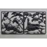 A pair of Lauchhammer Art Deco cast & pierced iron square panels depicting running hares, a fox, &