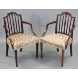 A pair of 19th century Hepplewhite-style mahogany carver chairs with shaped & carved rail-backs,