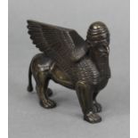 A 19th century bronze model of a Lamassus, the Assyrian protective deity; 3½” high x 4” long. (