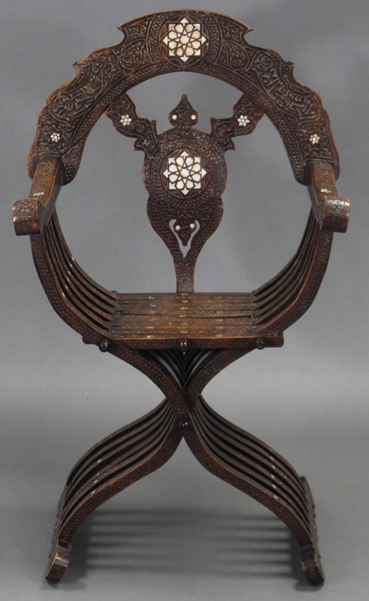 A late 19th/early 20th century carved walnut & mother-of-pearl inlaid Savonarola chair, with pierced - Image 2 of 3