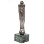 A 19th century Indian silver-covered furniture leg, with embossed lion-mask & foliate decoration,