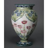 A MOORCROFT MACINTYRE POTTERY OVOID VASE with short flared neck & on round pedestal foot,