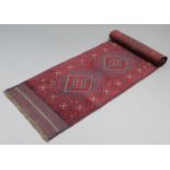 A Meshwari runner of crimson & blue ground with row of five lozenges in hook & geometric borders;