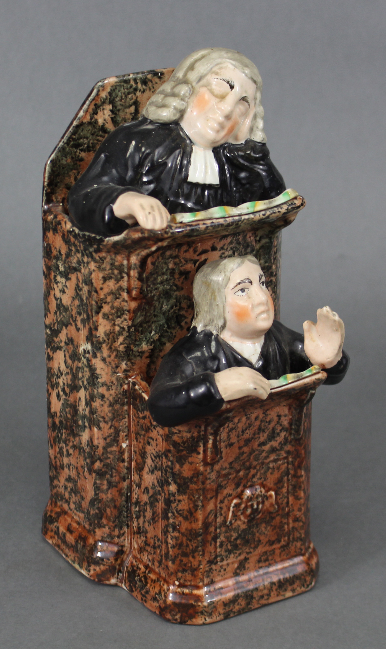 An early 19th century Staffordshire creamware pulpit group of ‘The Vicar & Moses’, the pulpit with