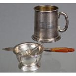 A silver Art Deco style tea strainer & bowl-shaped stand, Birmingham 1934, by Roberts & Dore; & an