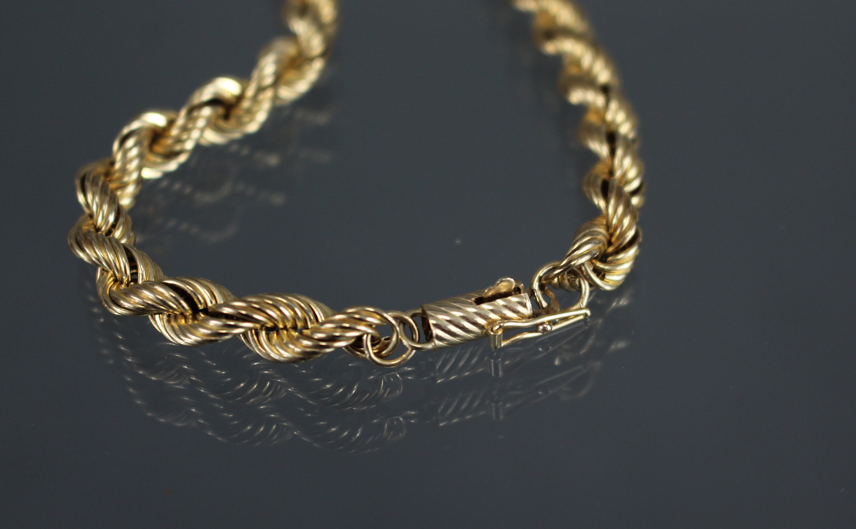 A 9ct. gold necklace of rope-twist design; 24” long. (14.3gm). - Image 3 of 3