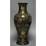 A Chinese porcelain vase of slender baluster form with short flared neck, all-over decorated in gilt