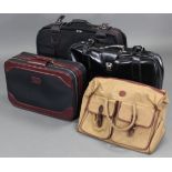 A modern black leather large ‘Antler’ suitcase; two other modern suitcases; a Ralph Lauren “Polo”