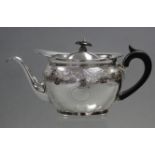 A George III silver oval teapot with wide rim & hinged domed lid, the curved sides with engraved