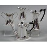 An Edwardian silver three-piece tea service & near-matching hot water jug, of waisted cylindrical