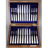 Twelve pairs of Edwardian silver dessert knives & forks with mother-of-pearl handles; Sheffield