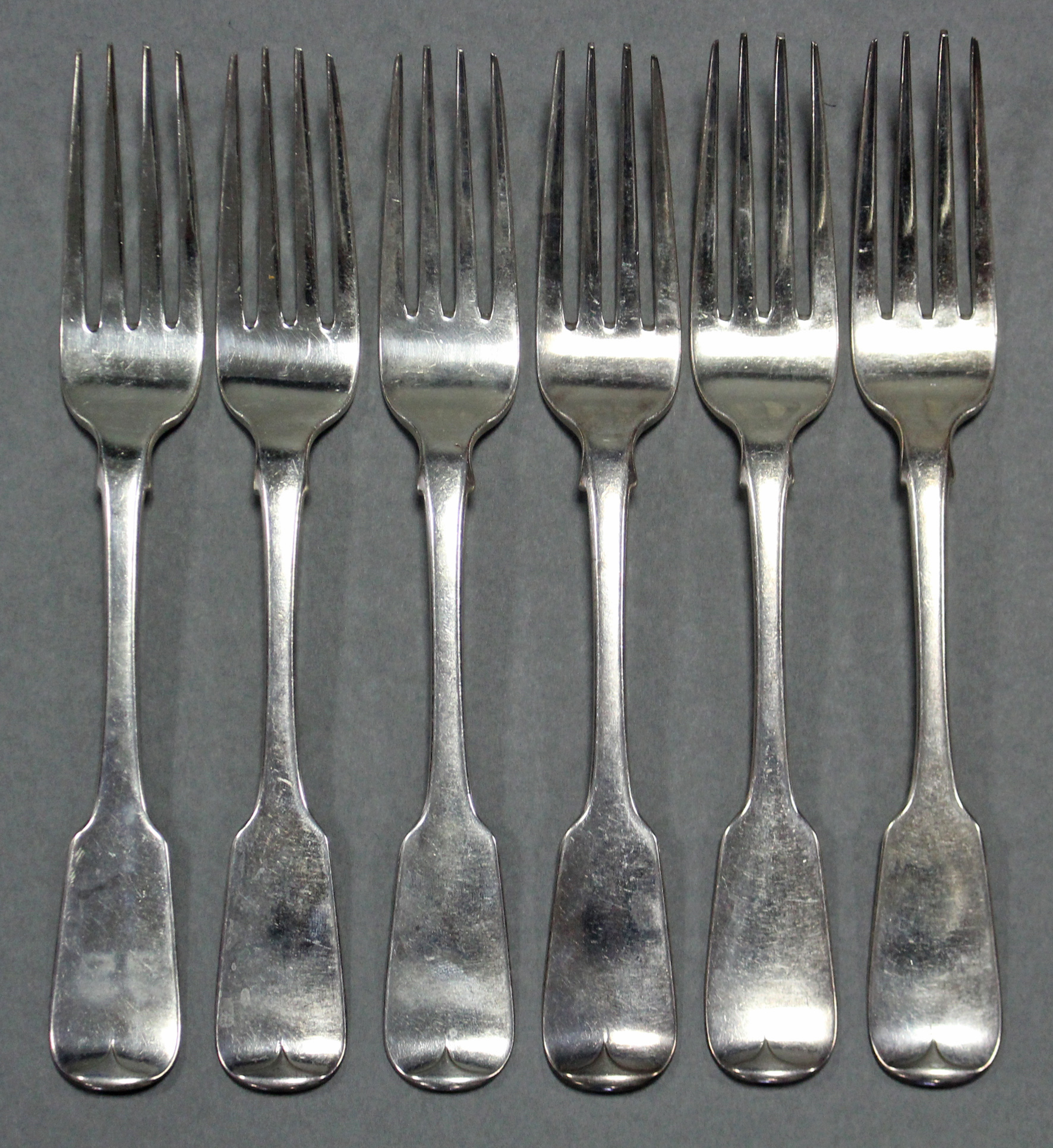 Six Irish George III silver Fiddle pattern table forks; Dublin 1804, by Charles Marsh (?);