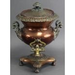 An early 19th century copper samovar, with fluted & foliate decoration, scroll & ebonised side