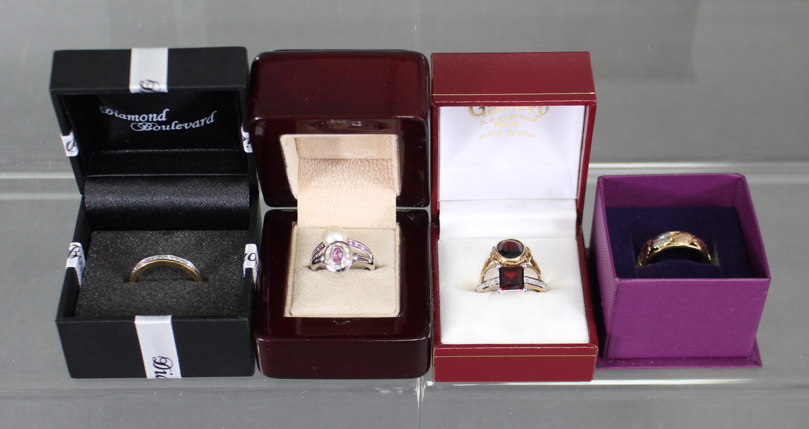 A quantity of costume jewellery, including five 9ct. gold gem-set rings, & a 9ct. three-colour