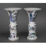 A pair of Chinese Doucai porcelain Gu-shaped vases, with all-over decoration of antiques &