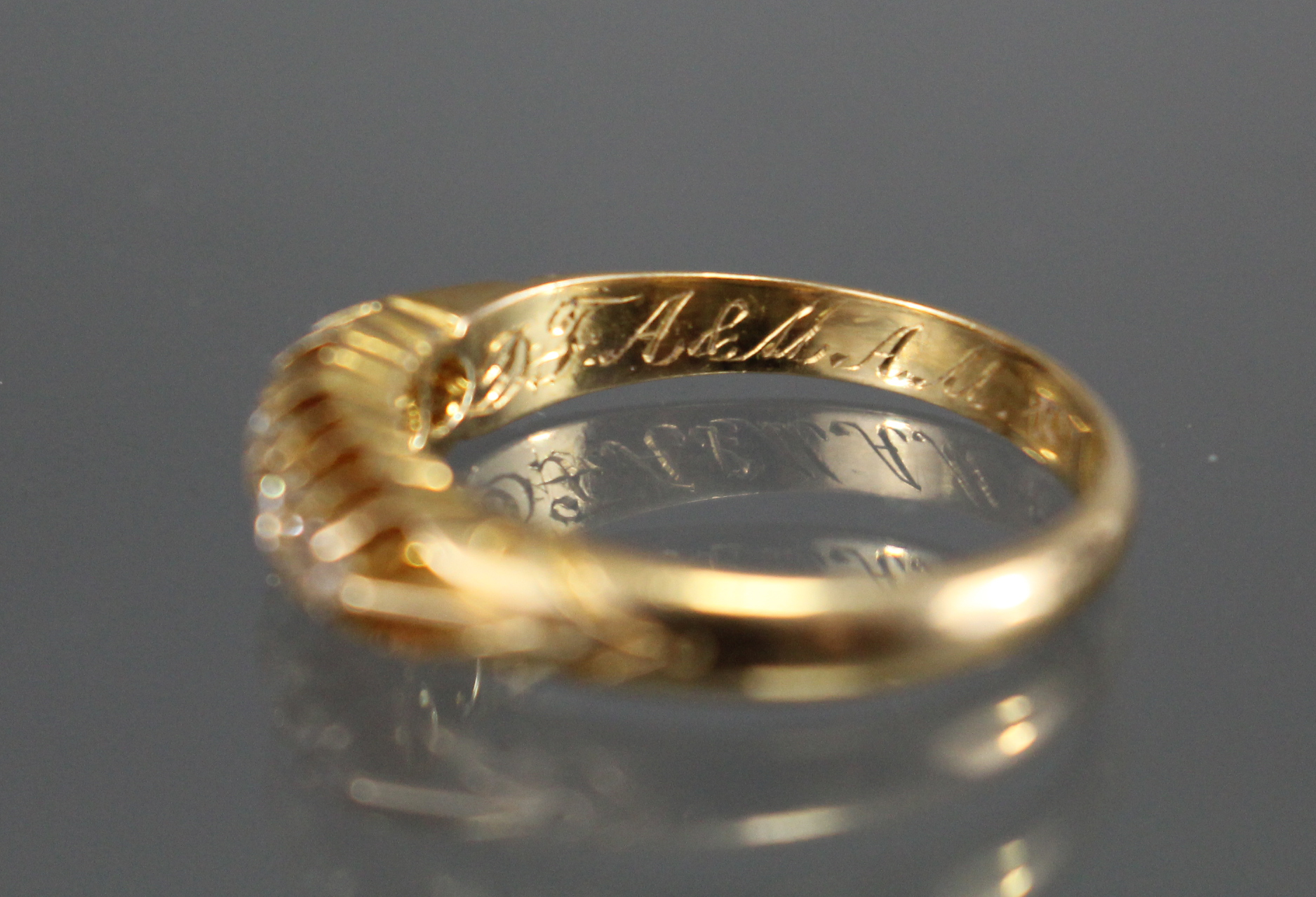 A late Victorian 18ct. gold ring set five small graduated diamonds, Birmingham hallmarks for 1899; - Image 4 of 4