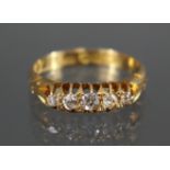 A late Victorian 18ct. gold ring set five small graduated diamonds, Birmingham hallmarks for 1899;