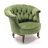 A late Victorian buttoned-back tub-shaped chair upholstered brass-studded green fabric, on square