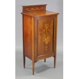 An Edwardian marquetry inlaid bow-front side cabinet with stage back, fitted three shelves