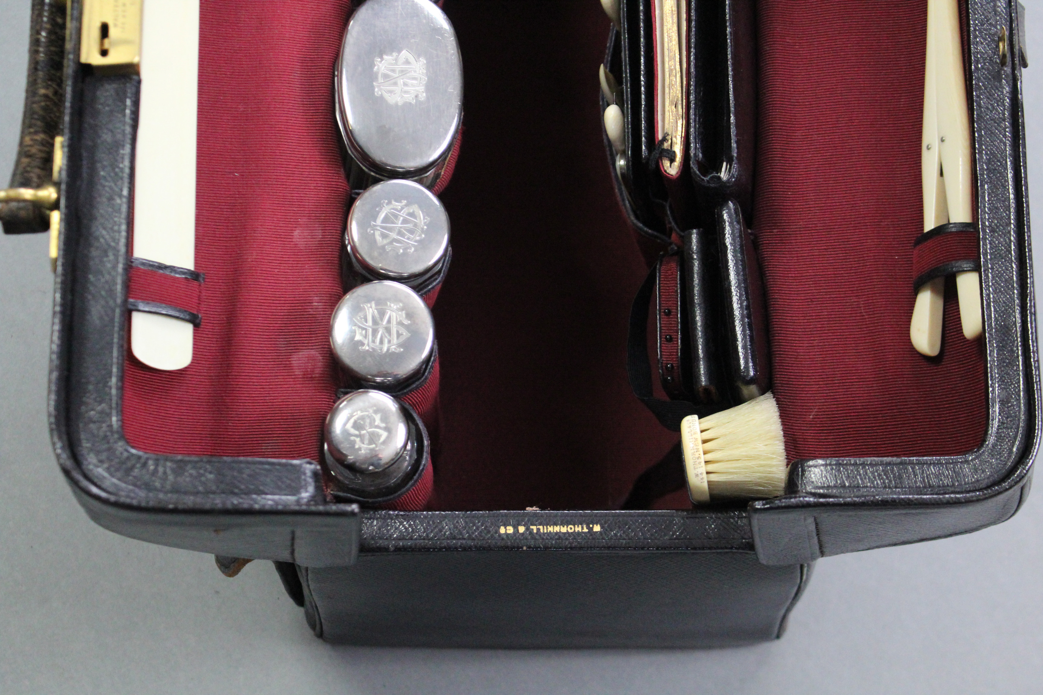 A late Victorian gentleman’s black leather travelling toilet case by W. Thornhill of New Bond St., - Image 7 of 7