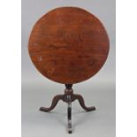 An 18th century oak & mahogany tripod table, with circular tilt-top on turned & spiral-fluted centre