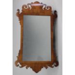 A George II style rectangular wall mirror in fret-carved mahogany frame with boxwood stringing;