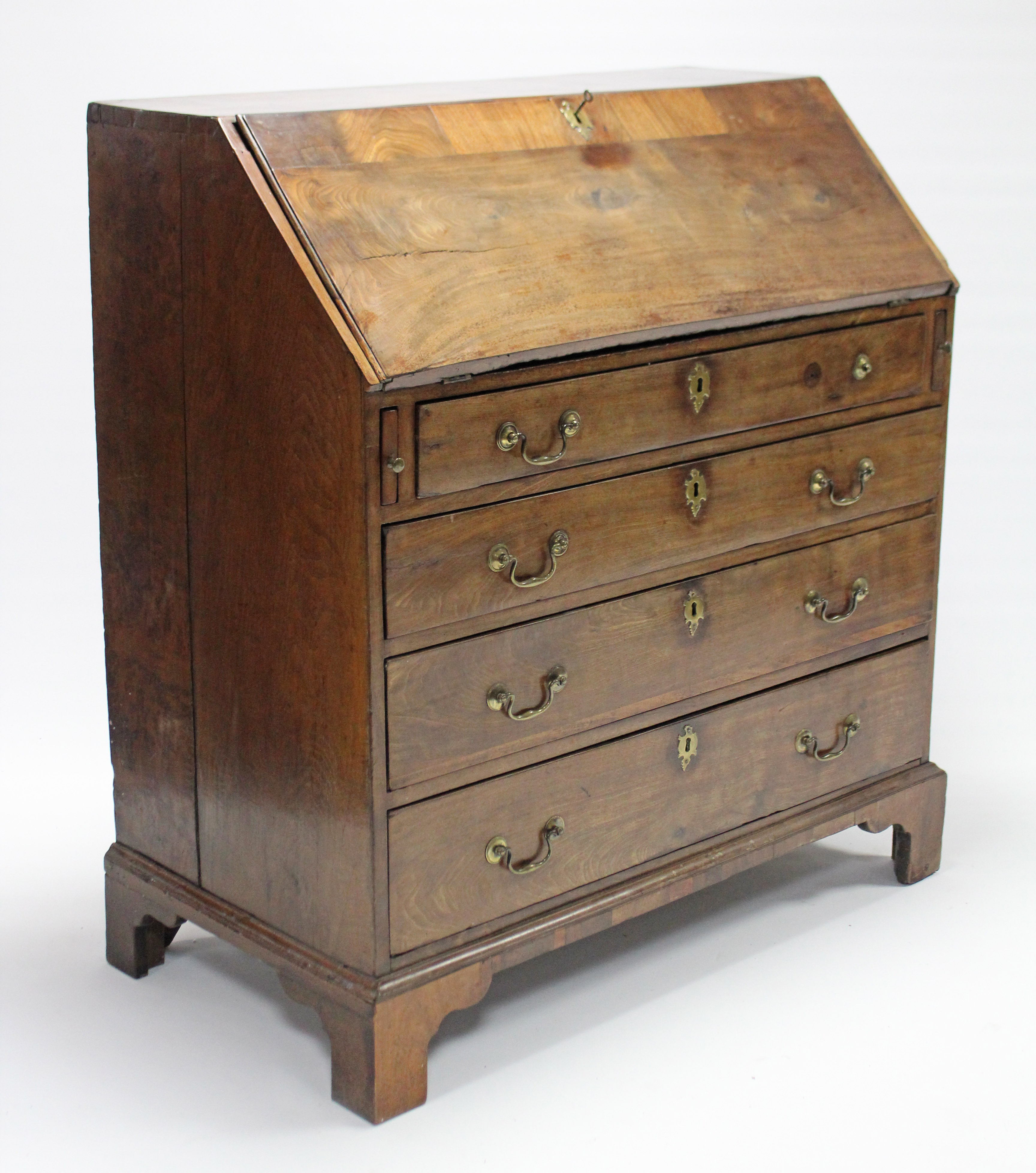 An 18th century mahogany, elm & burr-elm bureau with a fitted interior enclosed by fall-front