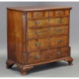 A MID-18th century FIGURED WALNUT CHEST, fitted two short & four long graduated drawers with
