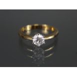 A diamond solitaire, the brilliant-cut stone approx. 0.7 carat, set to an 18ct. yellow gold shank;