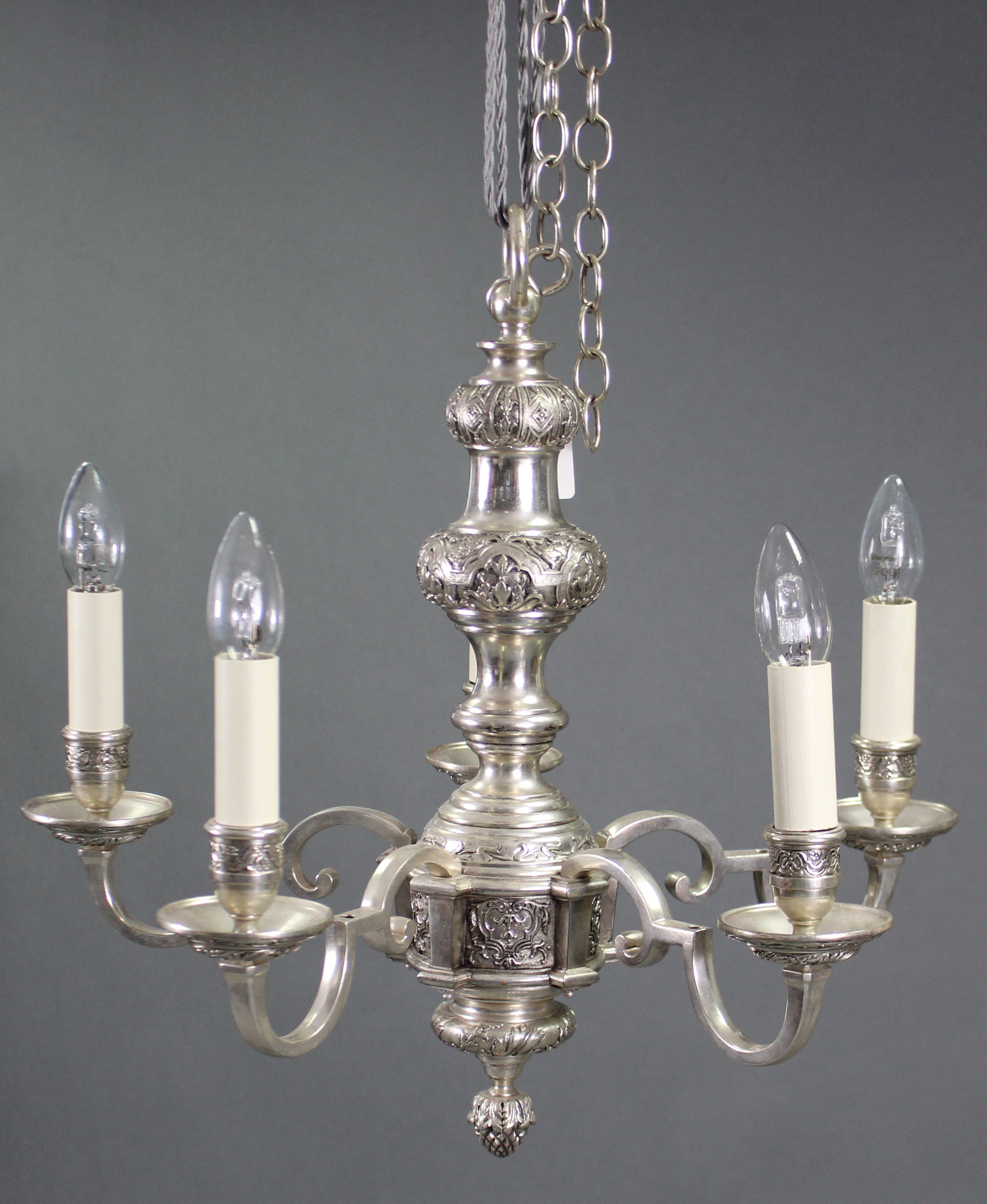 A heavy cast-metal Dutch-style six branch ceiling light fitting, with scroll arms & embossed