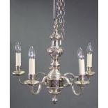 A heavy cast-metal Dutch-style six branch ceiling light fitting, with scroll arms & embossed