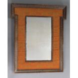 A 19th century rectangular wall mirror in foliate carved frame with shaped top & floral needlework