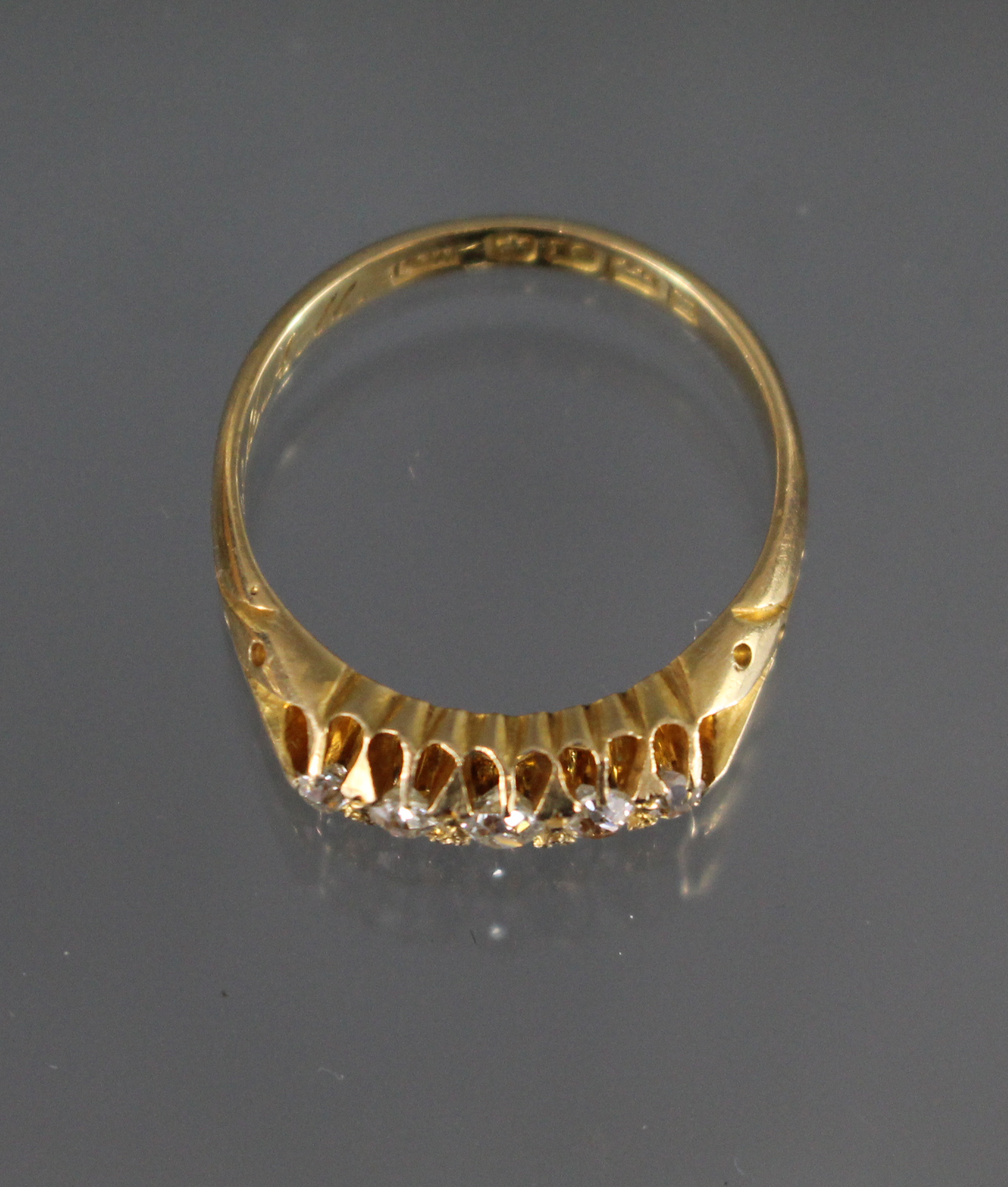 A late Victorian 18ct. gold ring set five small graduated diamonds, Birmingham hallmarks for 1899; - Image 2 of 4