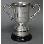 A George V silver trophy cup with acanthus scroll side handles & engraved inscription “F. G. C. (