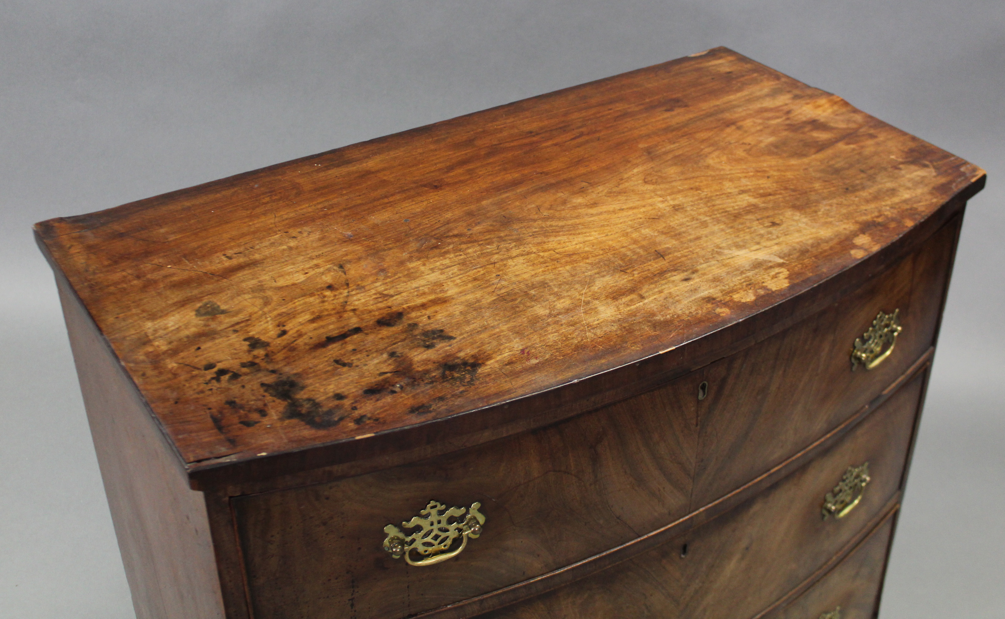 An early 19th century figured mahogany bow-front chest fitted three long graduated drawers with - Image 3 of 3