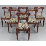 A set of six William IV mahogany bow-back dining chairs with scroll-carved top & centre rails,