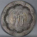 A Greek cast bronze large shallow dish, the centre decorated in relief with Christ on the cross