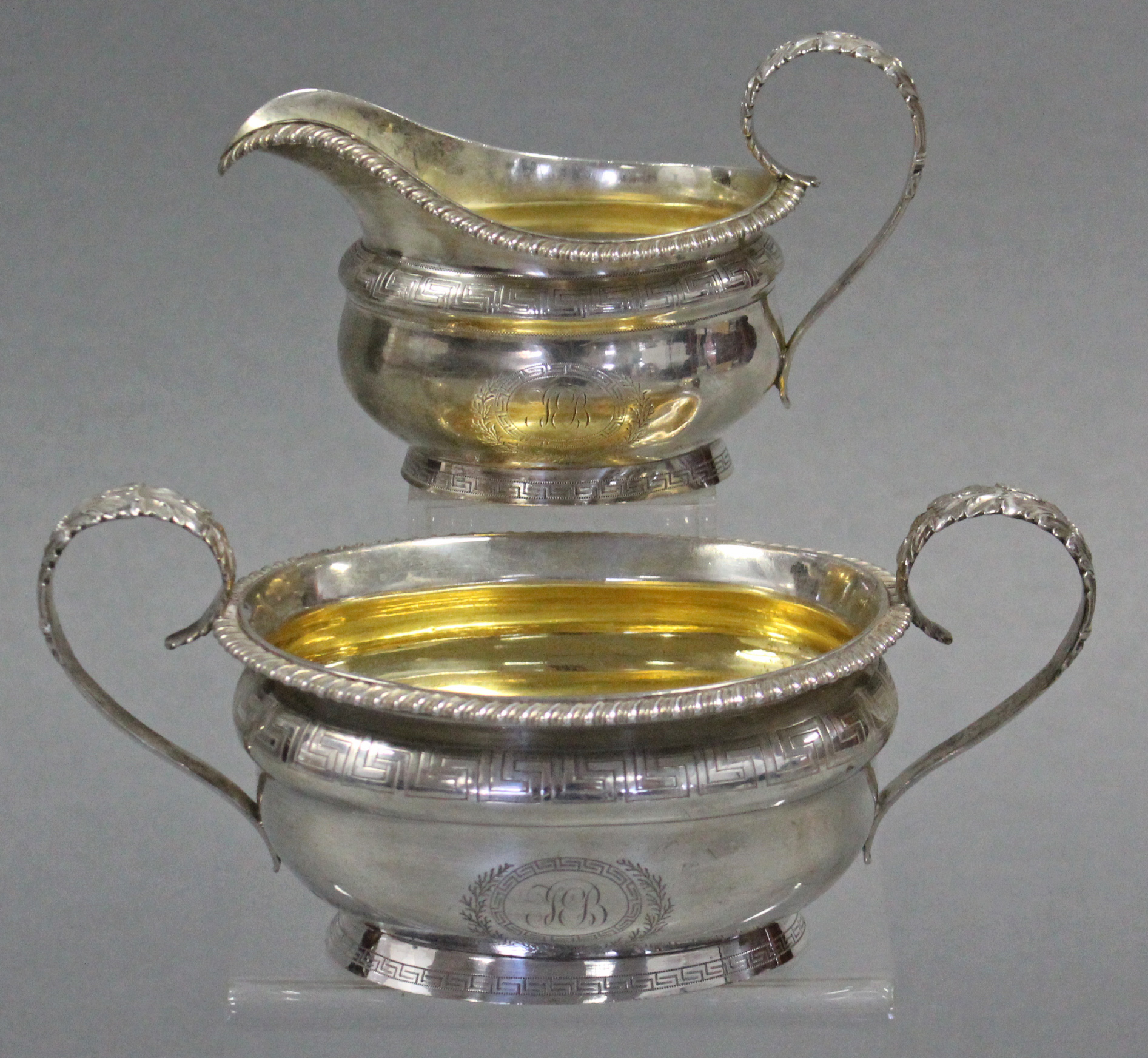A George IV silver two-handled sugar bowl & matching milk jug, both of compressed oval shape, with