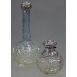 A Victorian cut glass toilet-water bottle with squat round body & tall narrow blue-tinted neck,