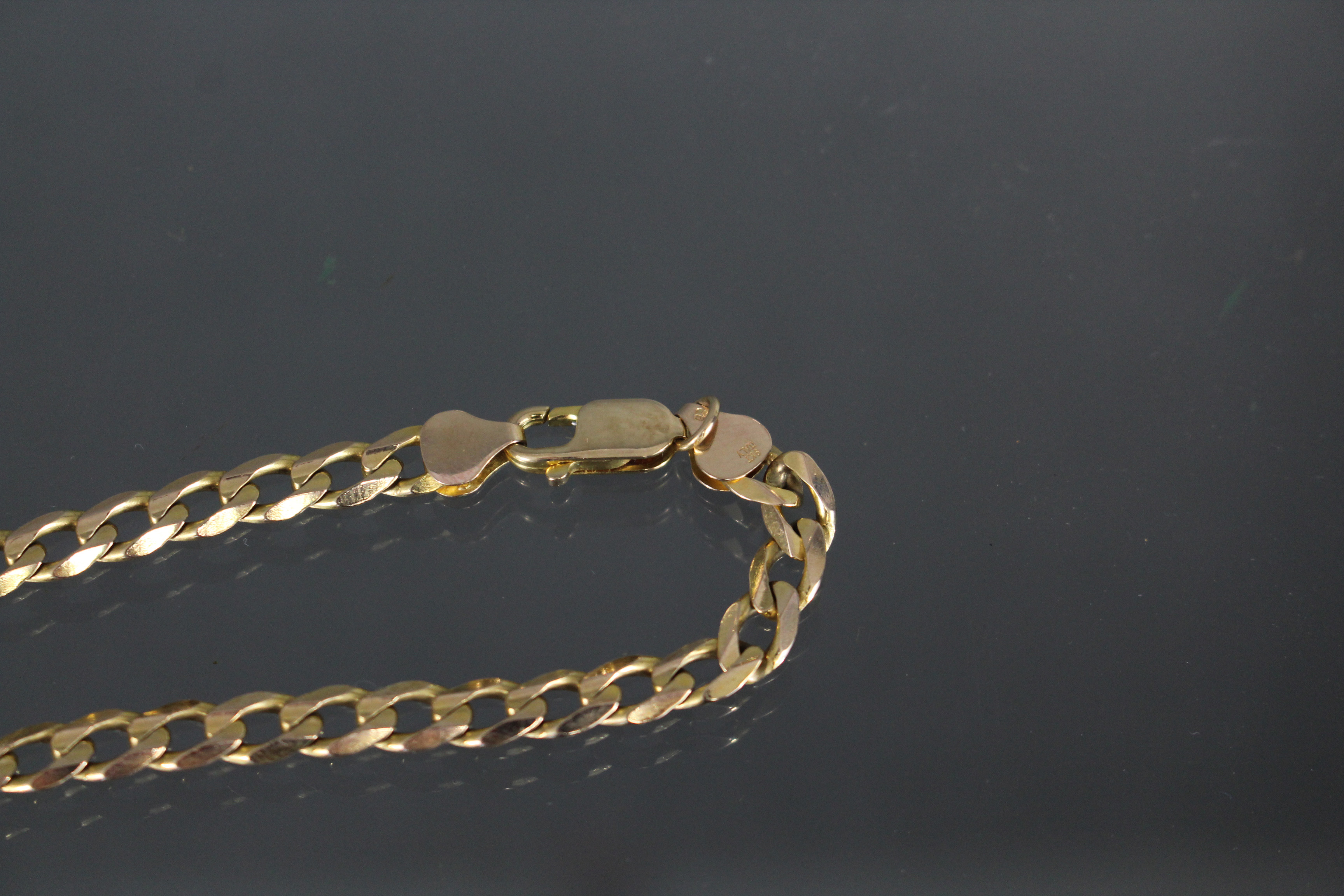 A 9ct. gold necklace of flattened curb links. (21.5gm). - Image 3 of 3