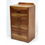 A small oak upright chest, fitted five long drawers with block handles, 23¾” wide x 40½” high.