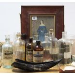 A collection of approximately thirty various apothecary bottles; a full-length female portrait;