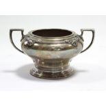 A George VI silver two-handled circular sugar bowl with shell & scroll motifs to the rim, on round