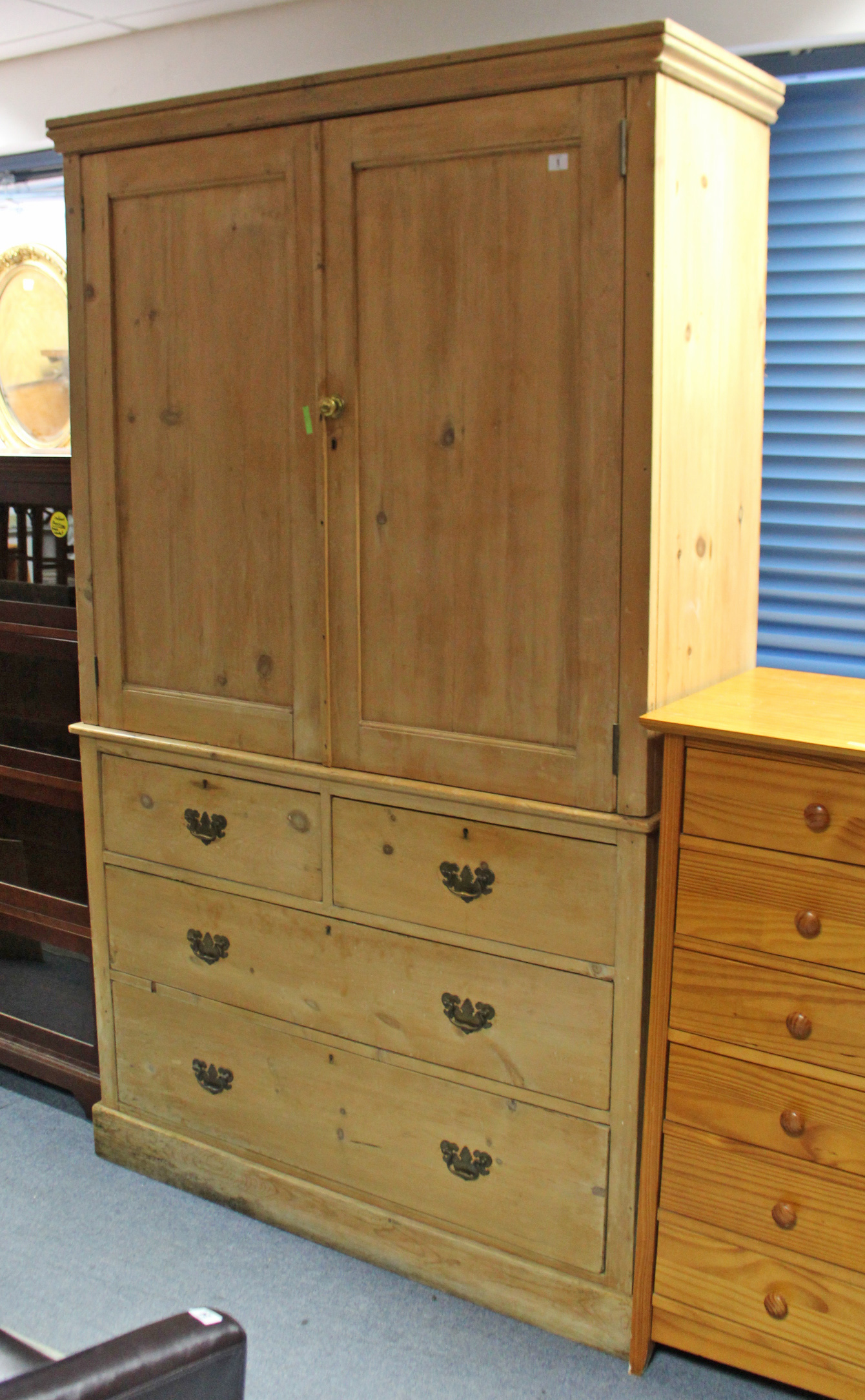 A VICTORIAN PINE LINEN PRESS, the upper part fitted three shelves enclosed by pair of panel doors,