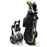 A matched set of fourteen golf clubs with golf club bag & trolley.